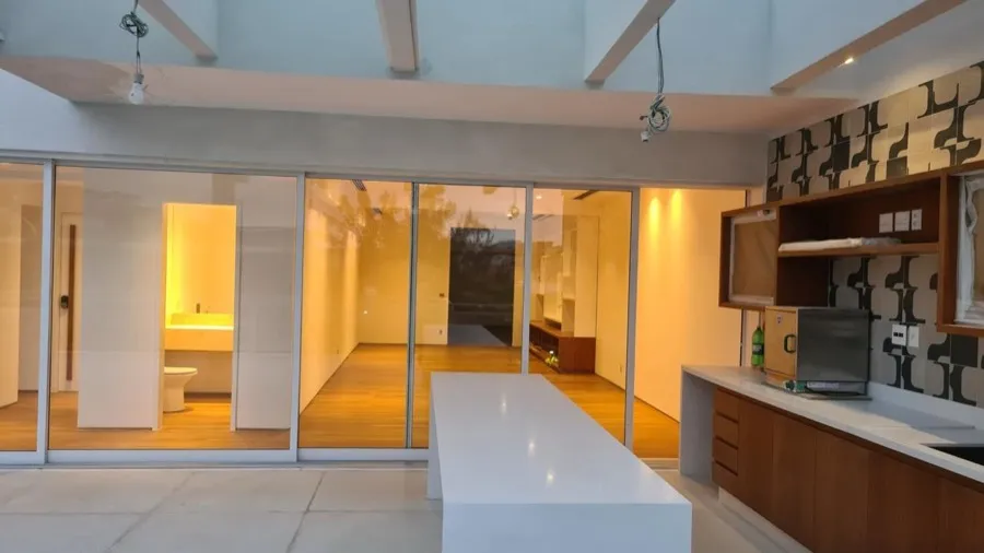 Cobertura com área gourmet — area integrada noite. Obra da Alta Construtora.